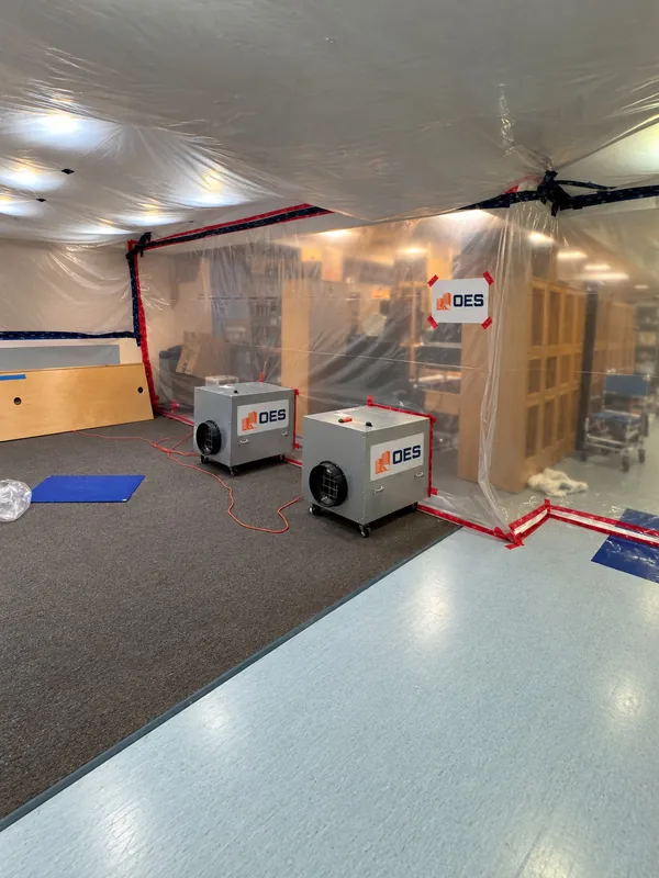 Air scrubbers with OES labels running inside plastic containment